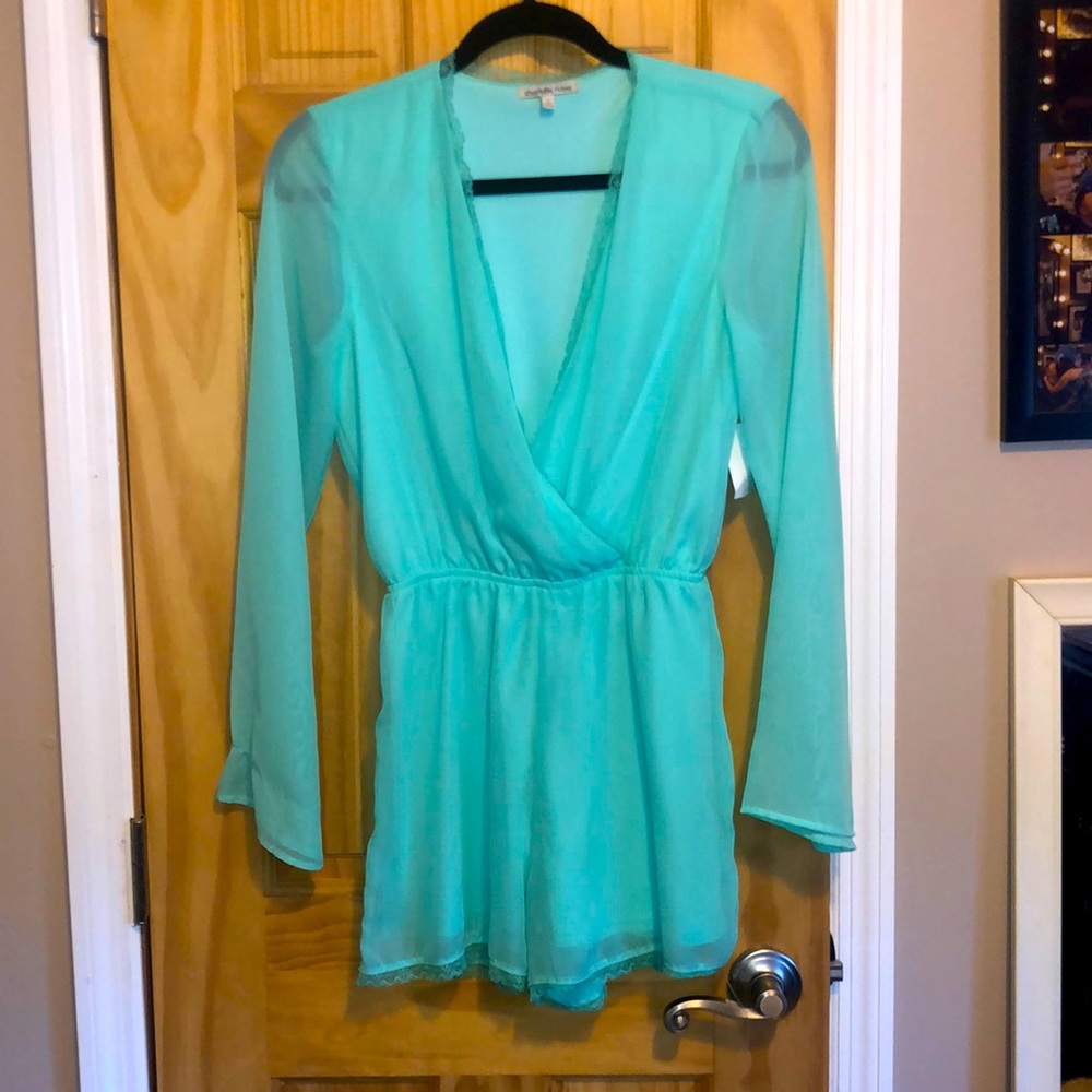 Plunging neckline long sleeve romper.